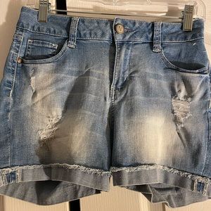 Light washed denim cuffed shorts.